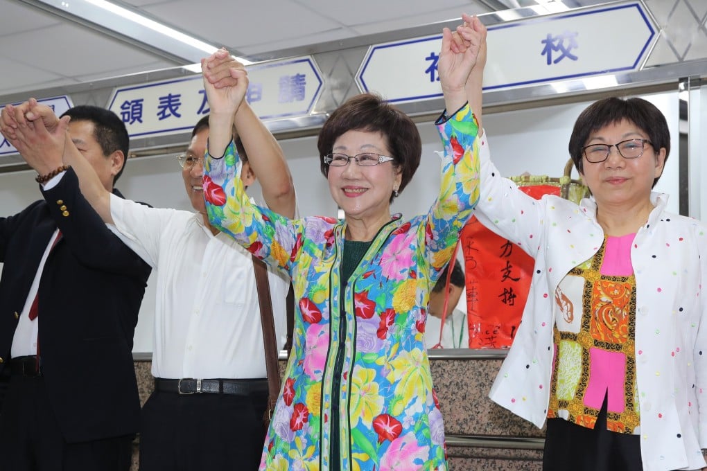 Annette Lu Hsiu-lien, former vice-president of Taiwan, (centre) celebrates her independent bid for the presidency with supporters. Photo: CNA