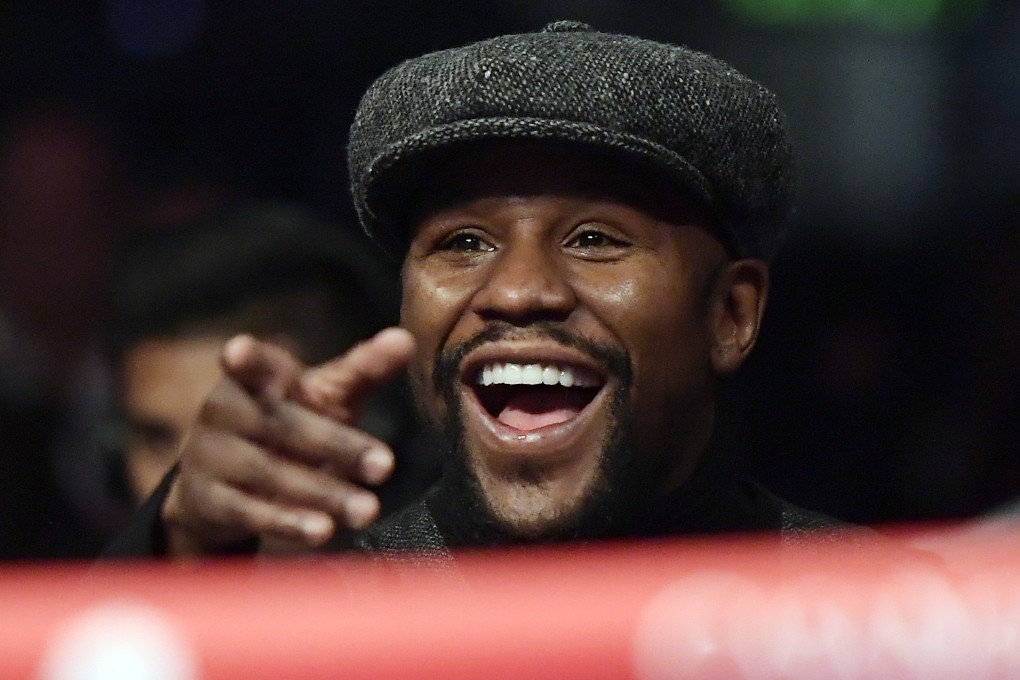 Floyd Mayweather watches a boxing match between Deontay Wilder and Tyson Fury in December 2018. Photo: AP