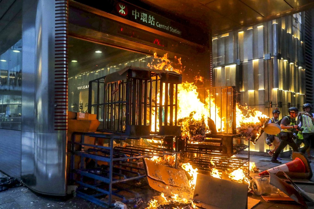 A fire burns on September 8 at one of the entrances to Central MTR station, in the business and financial heart of Hong Kong, during yet another weekend of violent protests. Photo: Edmond So