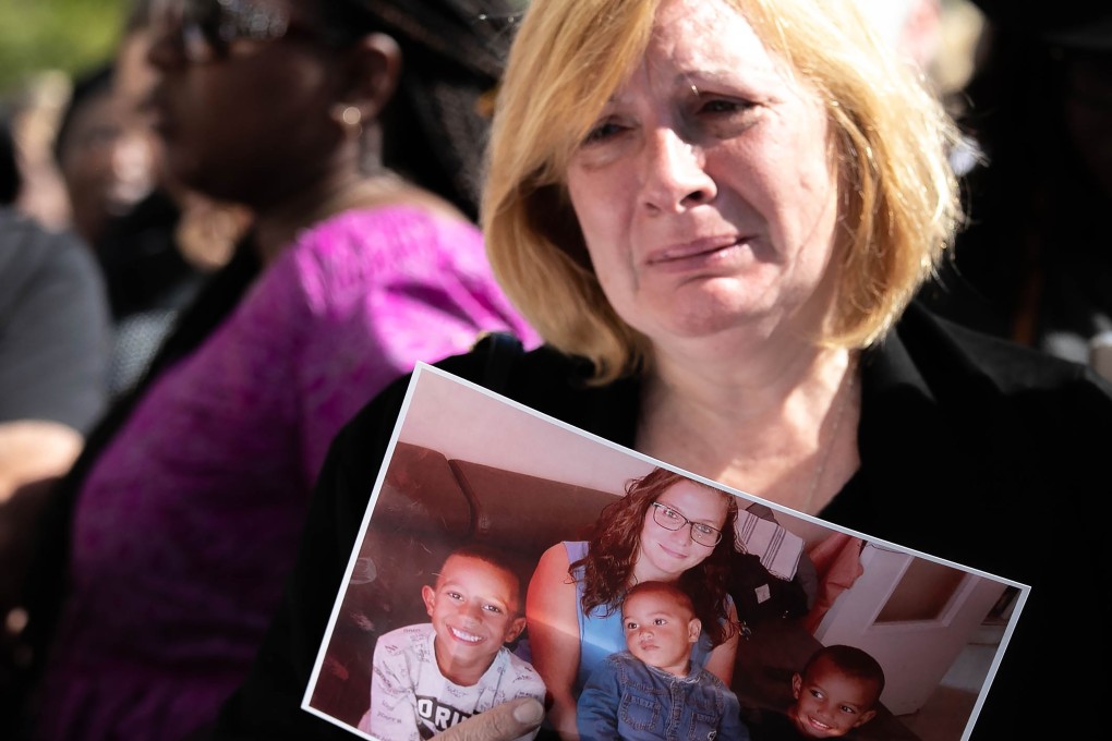 Johanna's grief-stricken mother with a picture of her daughter. Photo: AFP