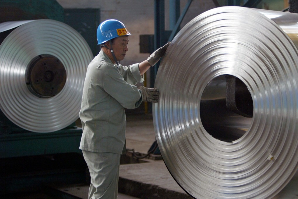 A labourer works at a cold-rolling mill in Wuhan, Hubei province. Steel, mining, construction and chemicals are some of the industries in urgent need of technology applications, according to investors. Photo: Reuters