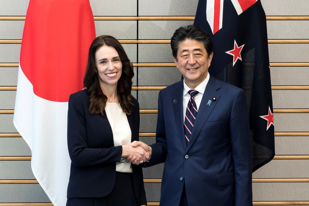 New Zealand’s Prime Minister Jacinda Ardern shakes hands with Japan’s Prime Minister Shinzo Abe. Photo: Reuters
