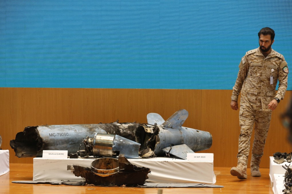A Saudi military officer walks next to what was described as a misfired Iranian cruise missile used in an attack this weekend. Photo: AP