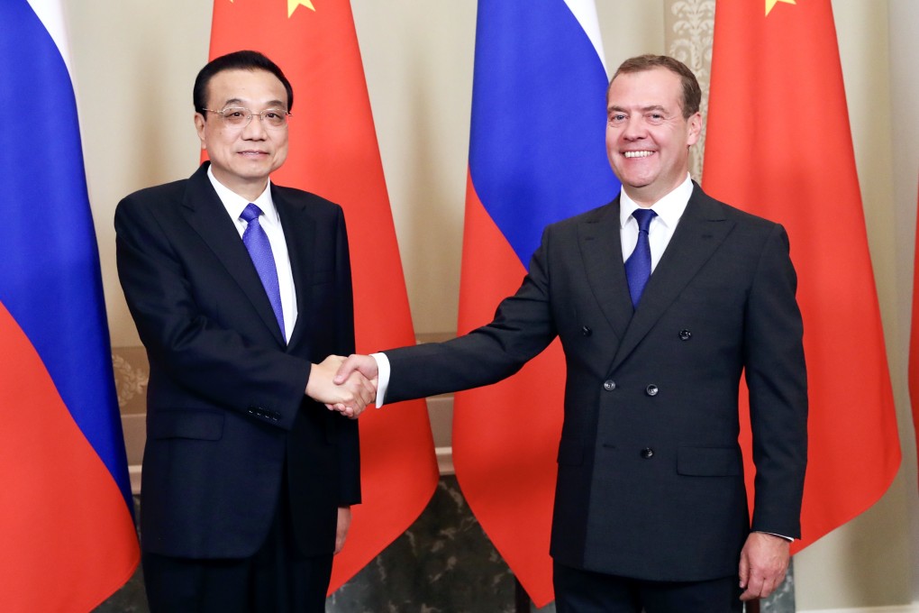 Chinese Premier Li Keqiang and Russian Prime Minister Dmitry Medvedev say they are committed to boosting trade. Photo: Xinhua