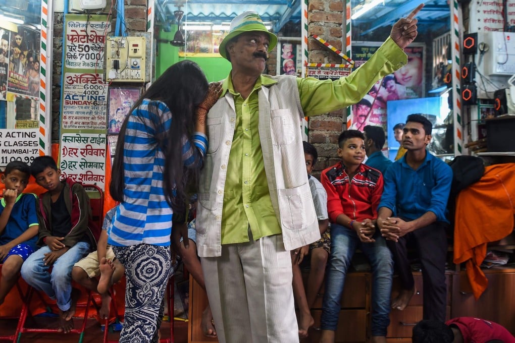 Acting teacher Baburao Ladsaheb performs for his students during a class at the ‘Five Star Acting Dancing Fighting Classes’ in Dharavi, Mumbai, one of India and Asia’s biggest slums. Photo: AFP