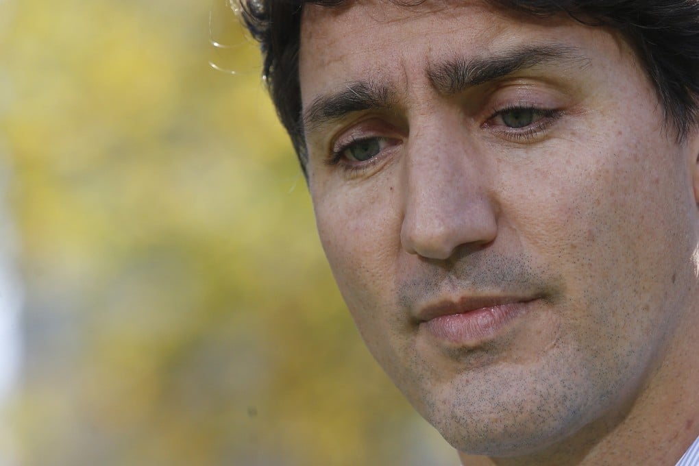 Canadian Prime Minister Justin Trudeau addresses the media regarding photos and video that have surfaced of him wearing racist make-up. Photo: AFP