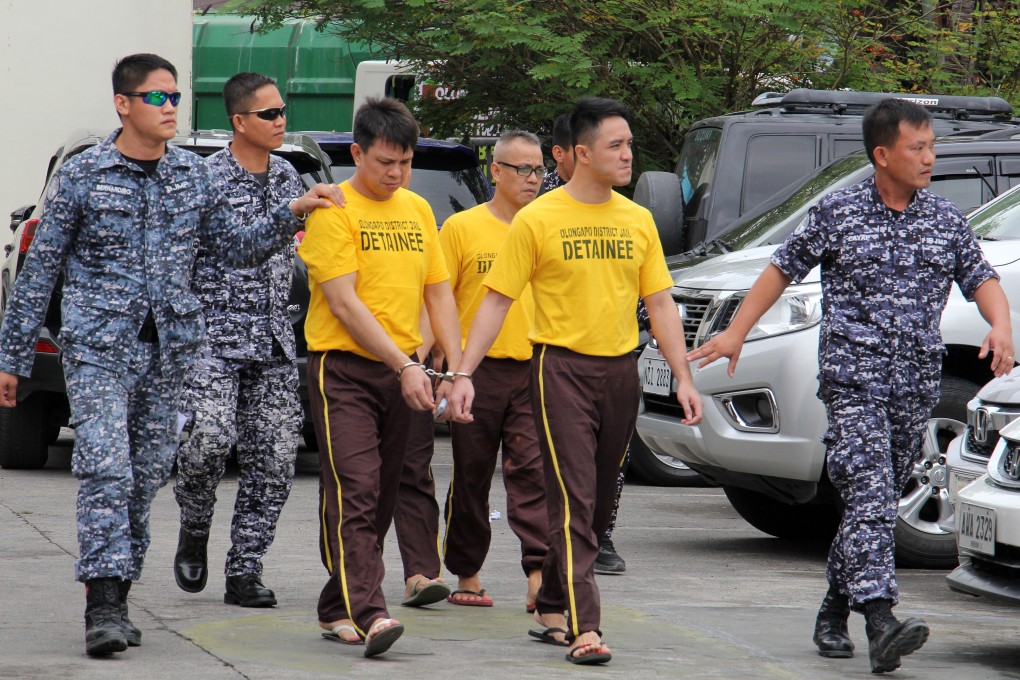 Chinese nationals convicted on drug charges being escorted by Philippine prison officials in December 2018. Photo: EPA