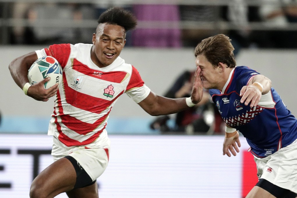 Japan’s Kotaro Matsushima (left) fends off Russia’s Vladislav Sozonov to score his third try during the Rugby World Cup pool A game at Tokyo Stadium. Photo: AP