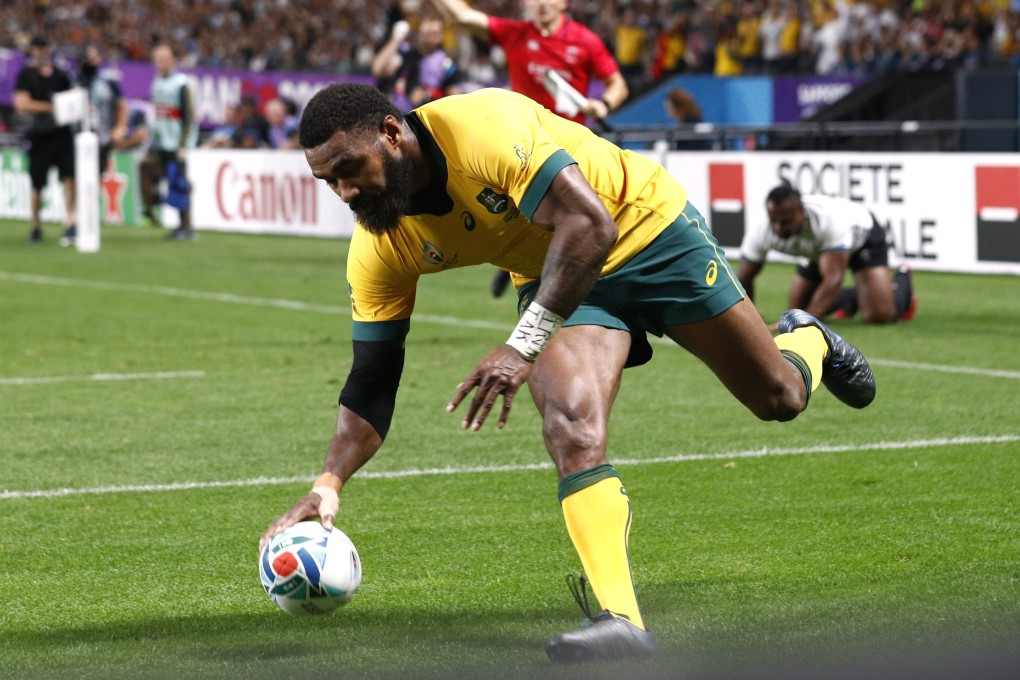 Marika Koroibete scores Australia’s fifth try. Photo: Reuters