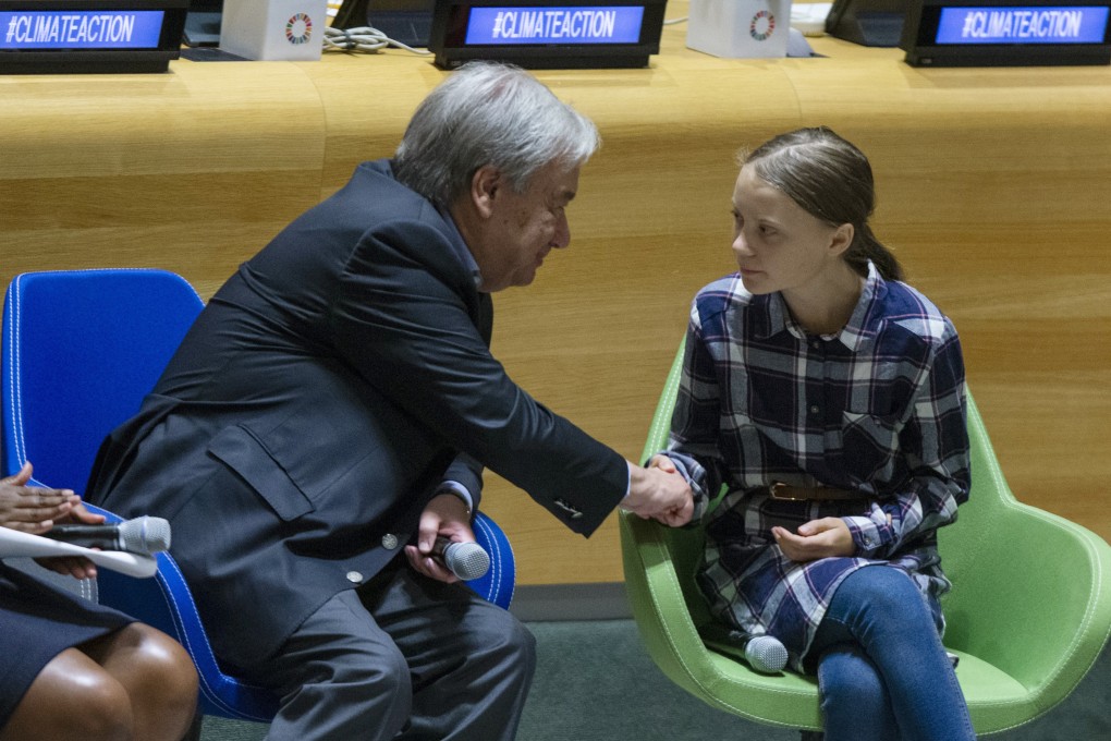 Swedish environmental activist Greta Thunberg shakes hands with UN Secretary-General Antonio Guterres. Photo: AP Photo