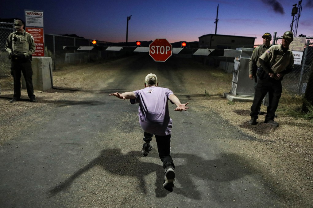 A man poses as if he is going to ‘Naruto run’ at an entrance to Area 51. Photo: Reuters