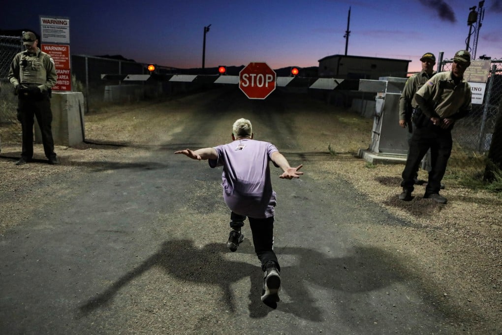 A man poses as if he is going to ‘Naruto run’ at an entrance to Area 51. Photo: Reuters