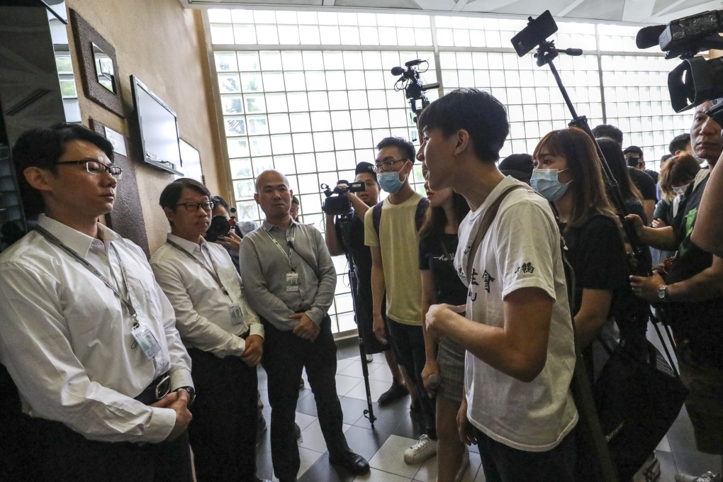 Student protesters at Baptist University in Kowloon Tong are blocked by security guards as they head for the principal’s office on September 18. The protesters felt the university had failed to adequately support a campus reporter who was arrested while covering the anti-government protests. Photo: Dickson Lee