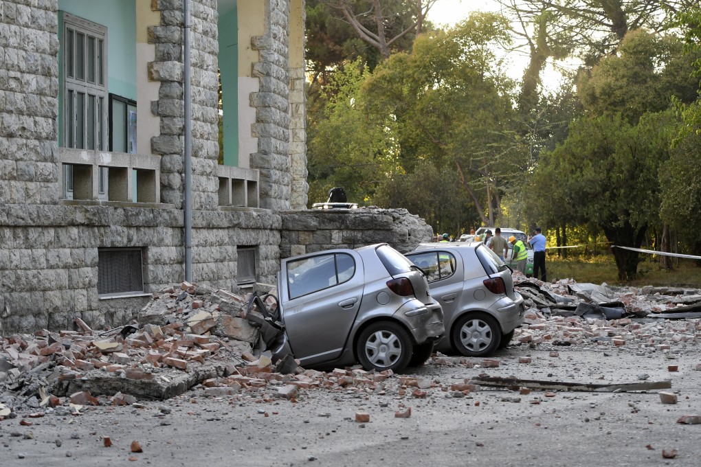 Damaged cars outside the Faculty of Geology building after an earthquake in Tirana. Photo: AP Photo