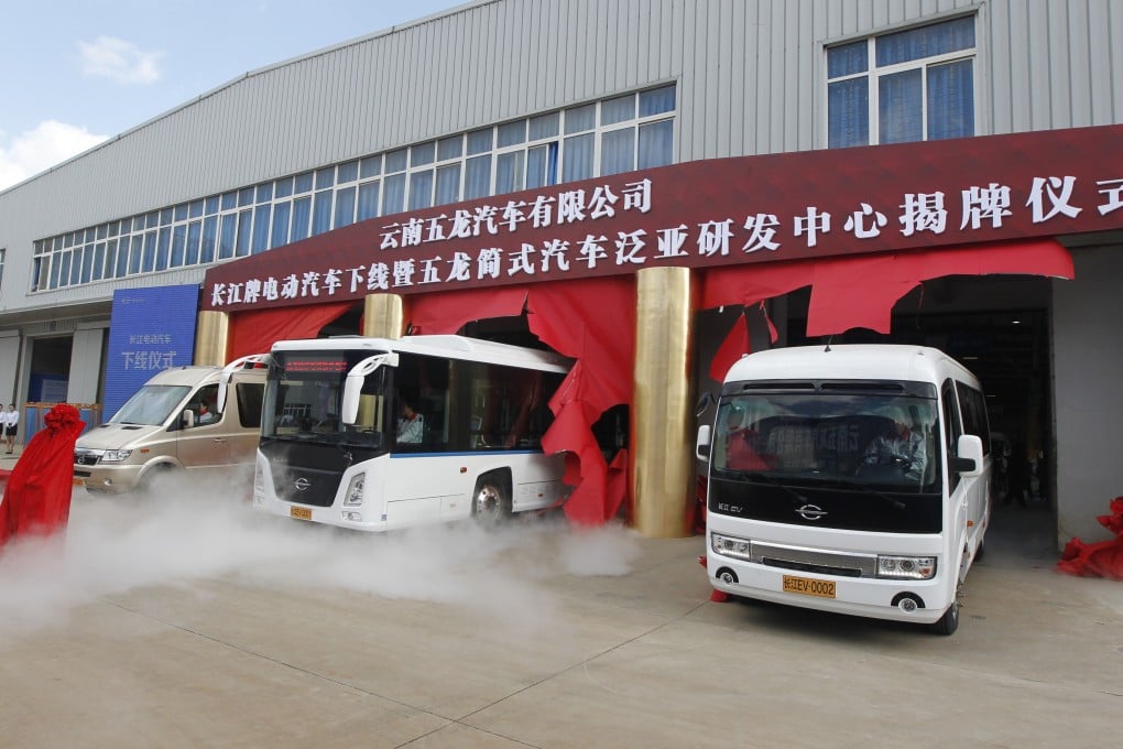 Newly assembled electric buses and vans are unveiled at an FDG plant in China’s Kunming city, in this file photo from November 8, 2014. Business has worsened recently, amid an economic slowdown in China as well as a scale back in government subsidies. Photo: Imaginechina