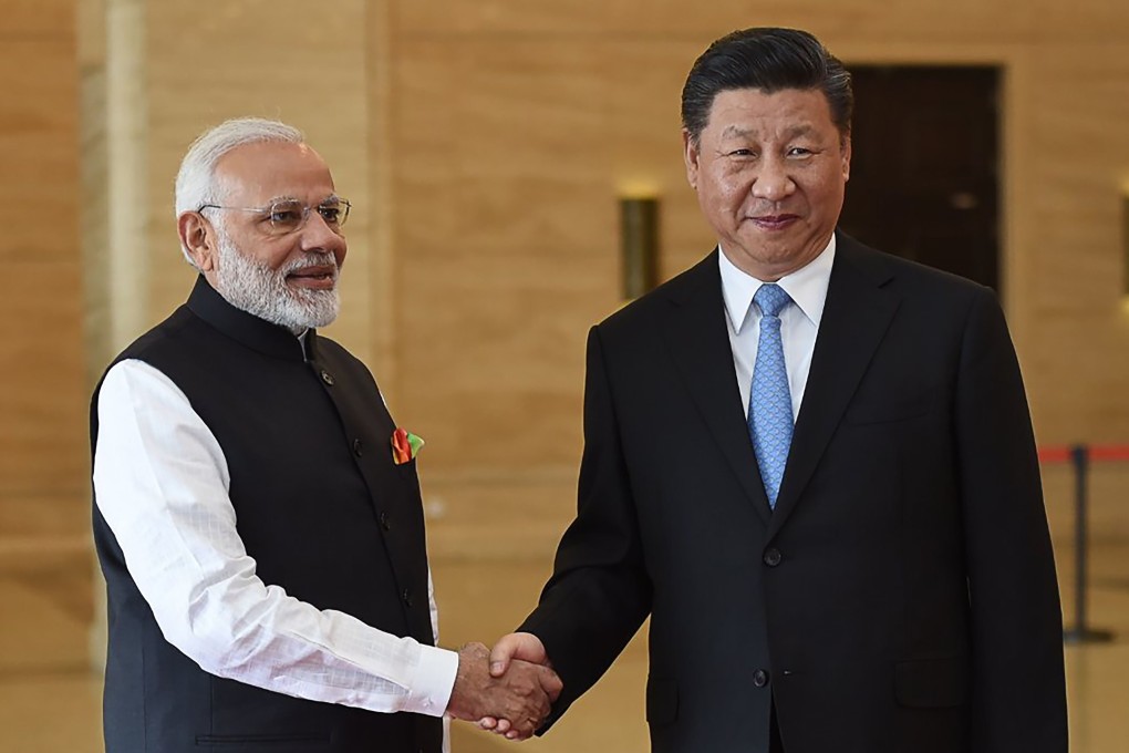 India’s Prime Minister Narendra Modi shakes hands with Chinese President Xi Jinping in Wuhan, China. Photo: AFP