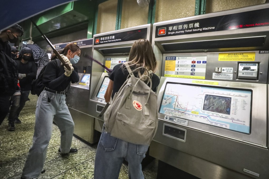 Protesters vandalise ticket machines at Kwai Fong MTR station on Sunday, but services are up and running across the network on Monday. Photo: Dickson Lee