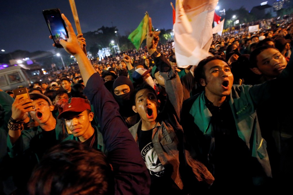 University students protest outside the Indonesian Parliament in Jakarta, Indonesia. Photo: Reuters