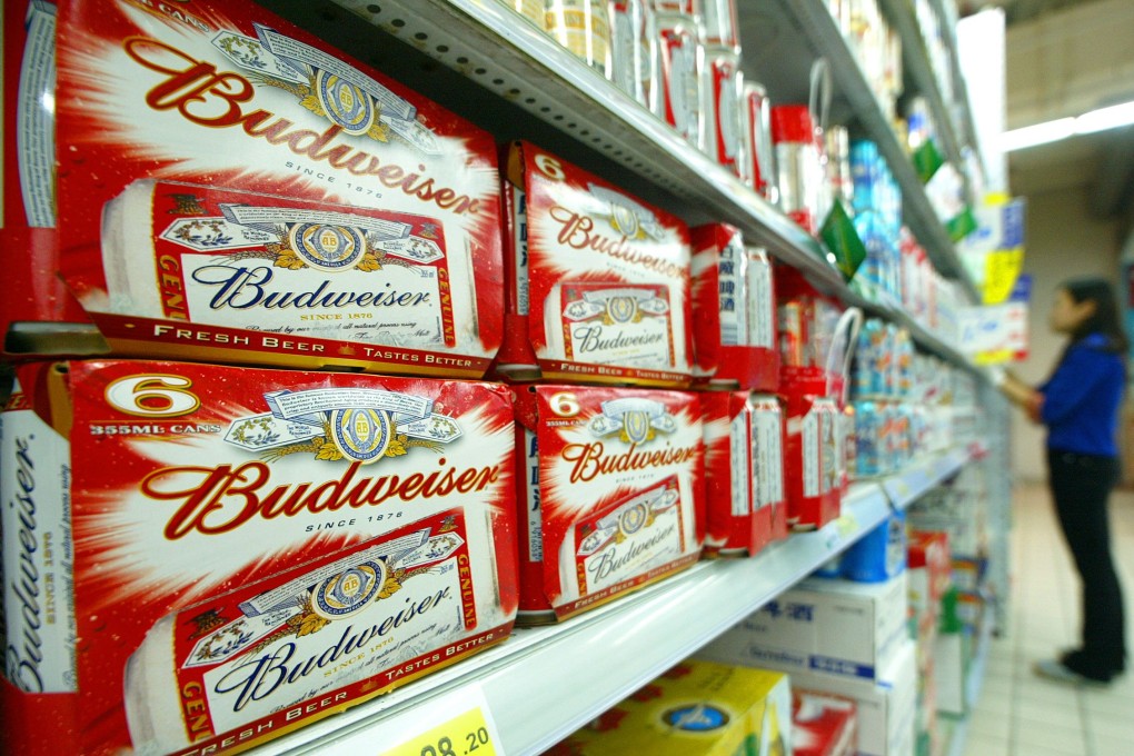 Packs of Budweiser’s beer are displayed in a Shanghai's supermarket on 20 October 2004. Photo: AFP