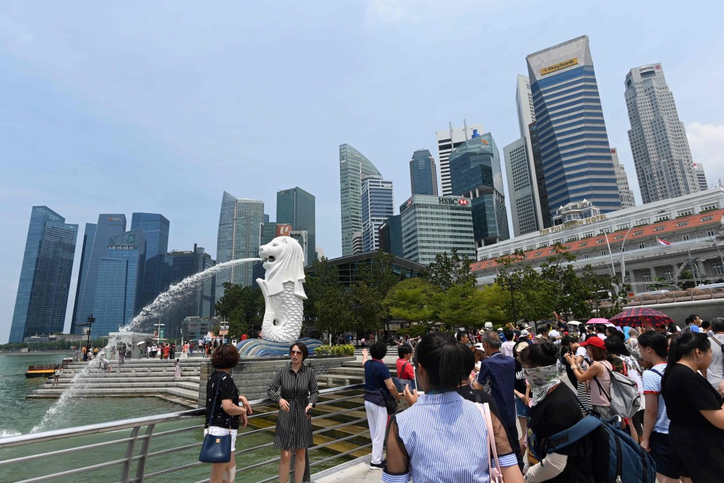 Visitors at the Merlion park in Singapore on August 13, 2019. Photo: AFP