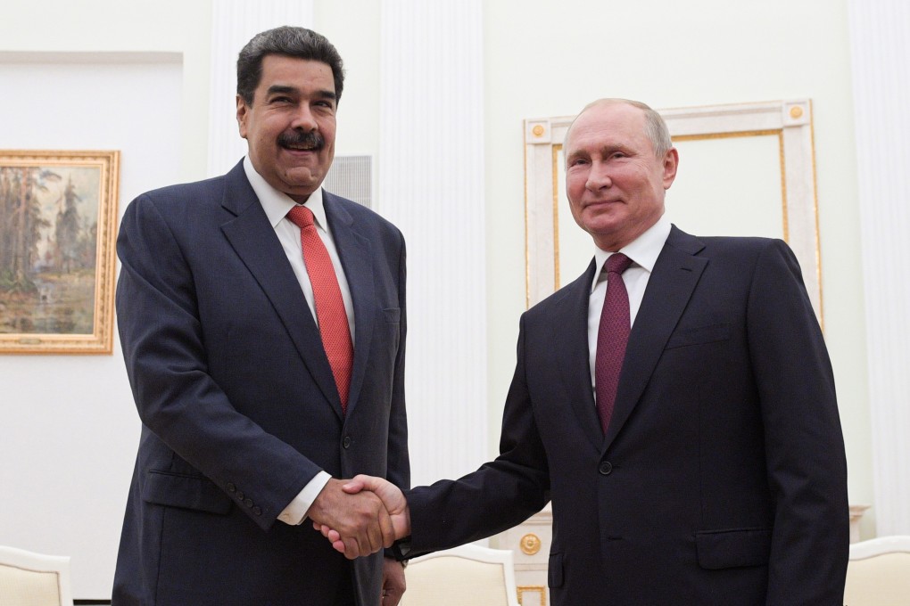 Russian President Vladimir Putin, right, shakes hands with Venezuelan President Nicolas Maduro. Photo: EPA