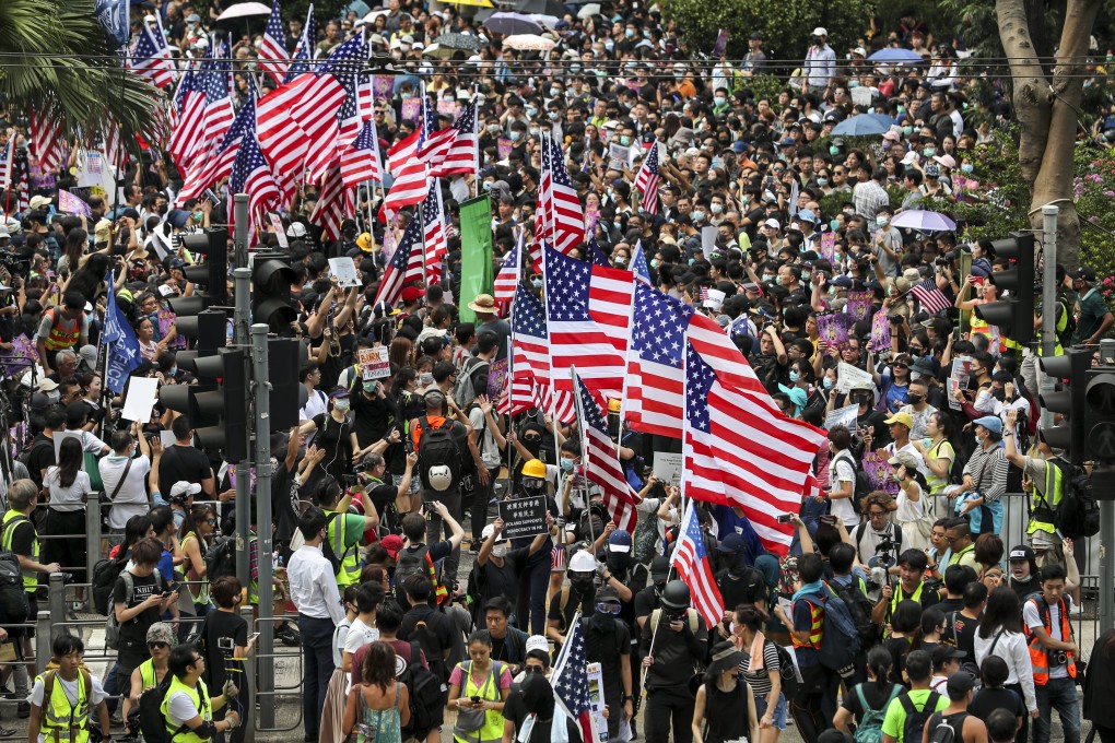 Hong Kong protesters wave US flags as they march to the Consulate General of the United States in Central to seek support for the “Hong Kong Human Rights and Democracy Act”, on September 8. On September 17, Joshua Wong was in Washington to testify before the US Congressional-Executive Commission on China about the pro-democracy movement in Hong Kong. Photo: Sam Tsang