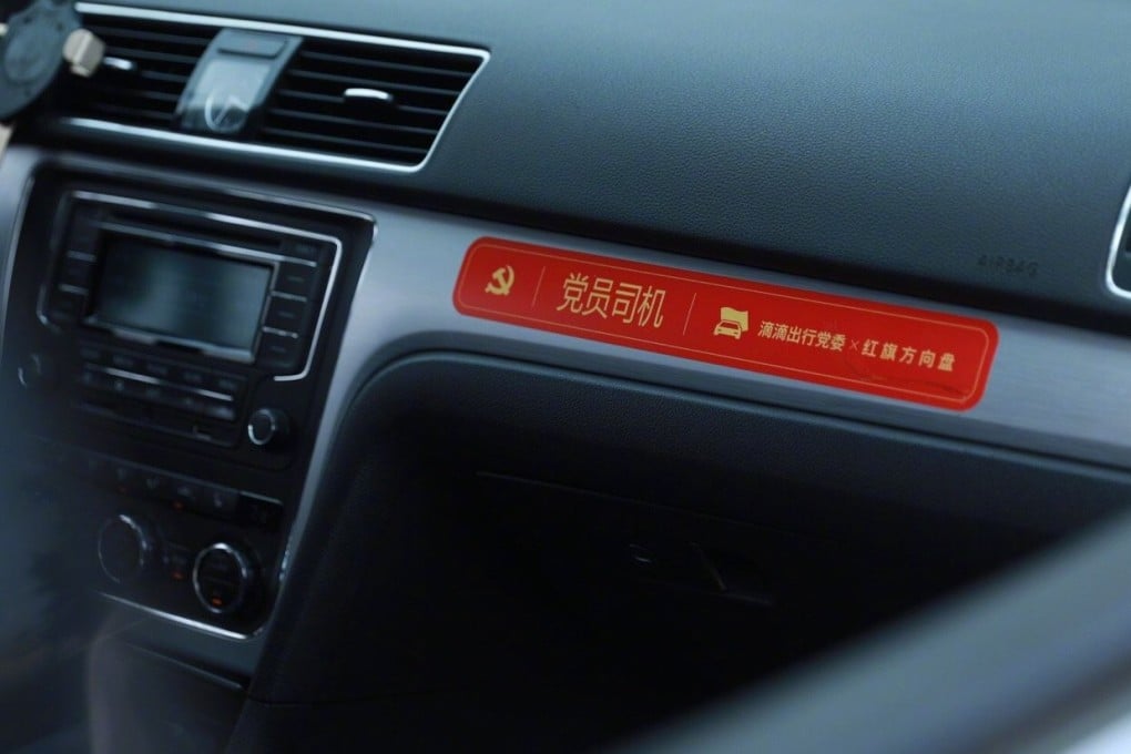 Travellers using Didi may encounter dashboard stickers announcing their driver’s Communist Party membership. Photo: Weibo