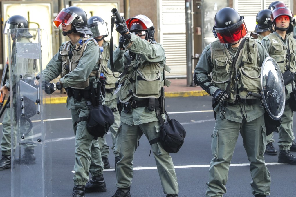 Riot police fire tear gas in clashes at Sha Tin MTR station. Photo: Edmond So
