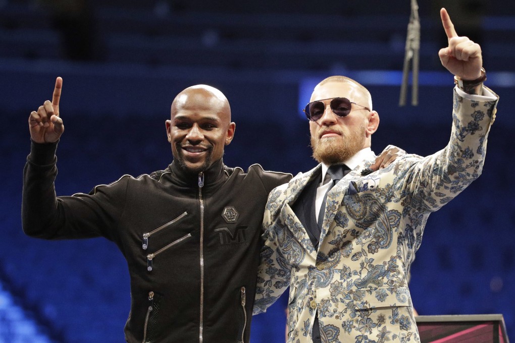 Floyd Mayweather and Conor McGregor pose together after their mega-money boxing bout in August 2017. Photo: AP