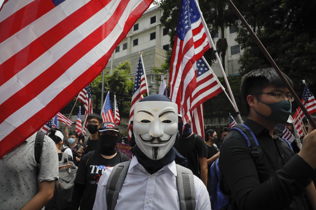 A protester wears a mask often associated with the hacker group Anonymous during a protest in Hong Kong. Photo: AP