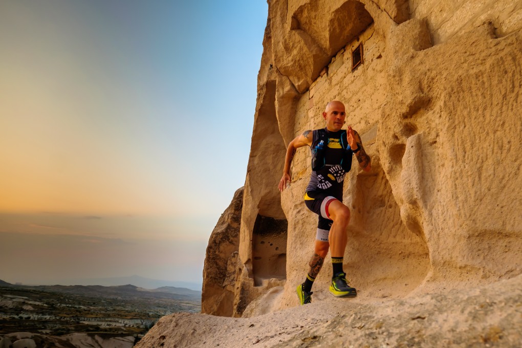 Gediminas Grinius running past houses cut into rock chimneys on the beautiful Cappadocia Ultra Trail. Photos: Steve Thomas