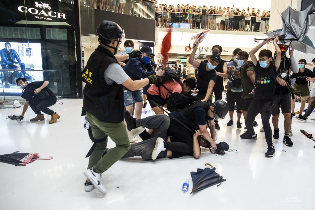 Riot police clash with demonstrators inside New Town Plaza shopping mall in Sha Tin on July 14. Photo: Bloomberg