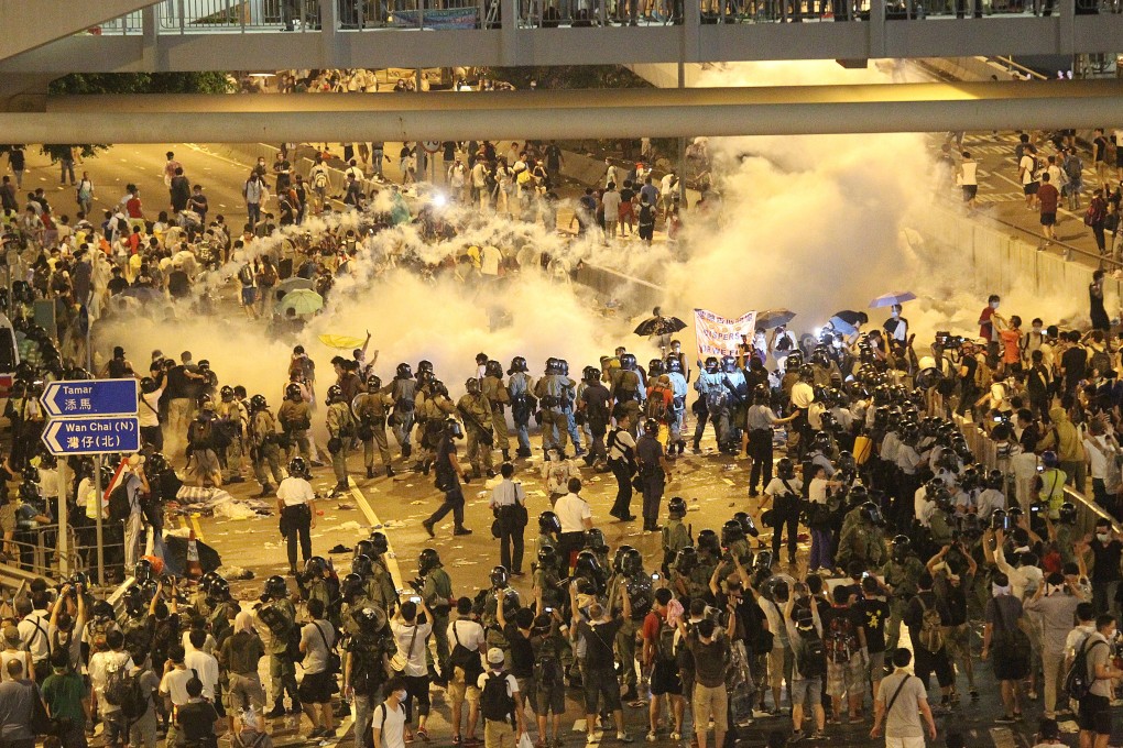 The police fire tear gas on Harcourt Road in Admiralty on September 28, 2014. Photo: Dickson Lee