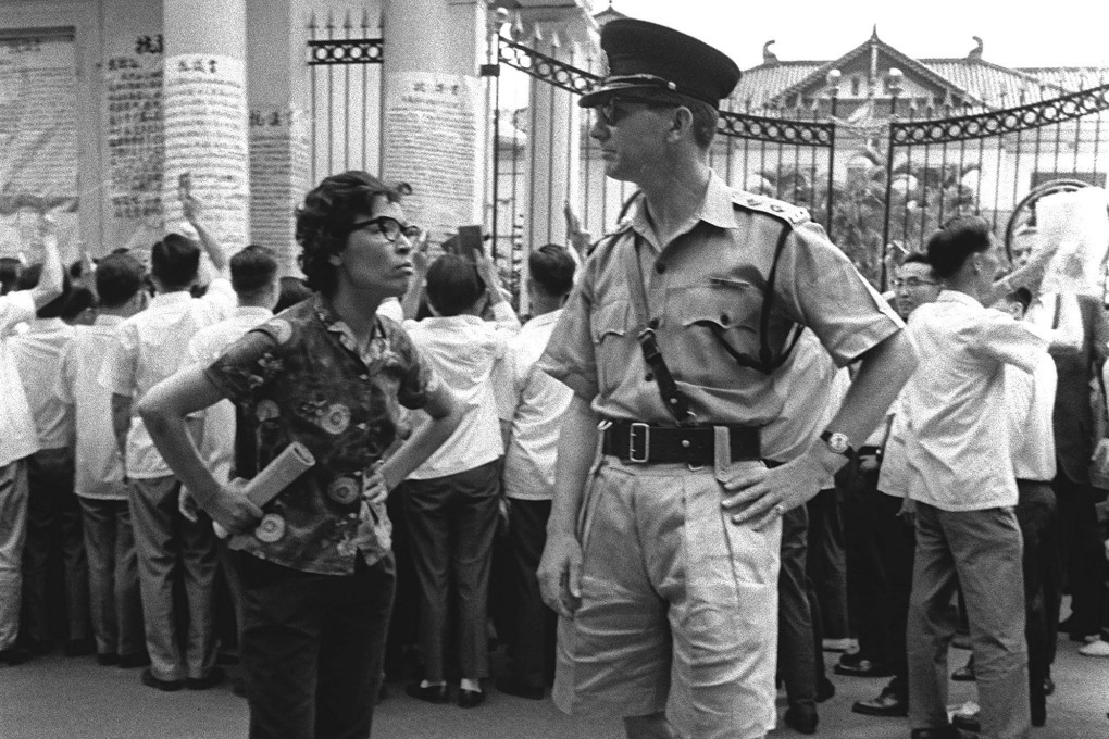 A Hong Kong policeman in khakhi drill at a protest outside Government House during the Black and white photo. Riot 1967 riots. Photo: SCMP