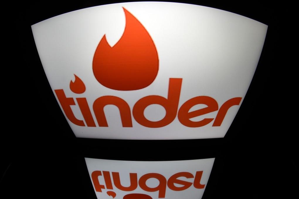 The logo of dating app Tinder on a tablet in Paris on March 15. Photo: AFP
