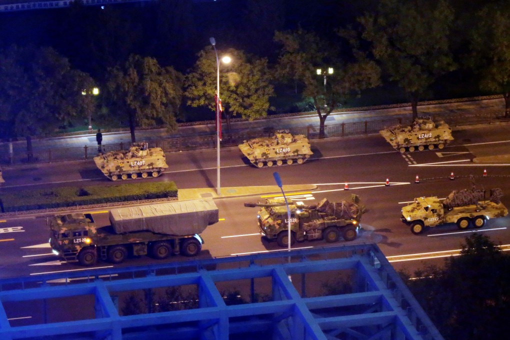 Military vehicles take to the streets of Beijing in preparation for the October 1 anniversary parade. Photo: Reuters