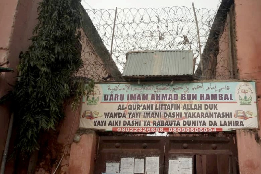 A sign is seen above a house, where police rescued men and boys in Nigeria. Photo: Reuters