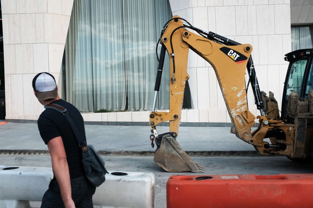 A man walks by a residential building still under construction in the newly developed, exclusive Hudson Yards neighbourhood in Manhattan, New York City, on September 13. While financial crises come and go with increasing frequency, the next one could be the “mother” of them all. Photo: Getty Images / AFP