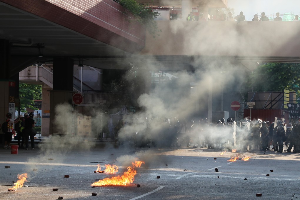 Anti-government protesters set objects on fire on a street in Tuen Mun on September 21. Photo: Sam Tsang