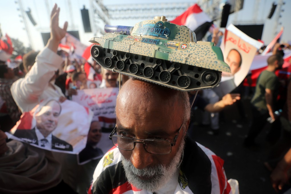 Supporters of Egyptian President Abdel Fattah al-Sisi chant slogans in Cairo on Friday. Photo: Reuters