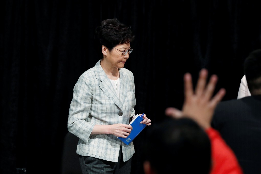 Hong Kong Chief Executive Carrie Lam reacts as member of the community raise his hands to ask questions during the first community dialogue session. Photo: Reuters