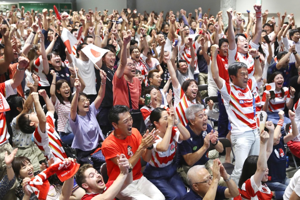 Japan supporters at a public viewing site in Tokyo celebrate after Kenki Fukuoka scored a try. Photo: Kyodo