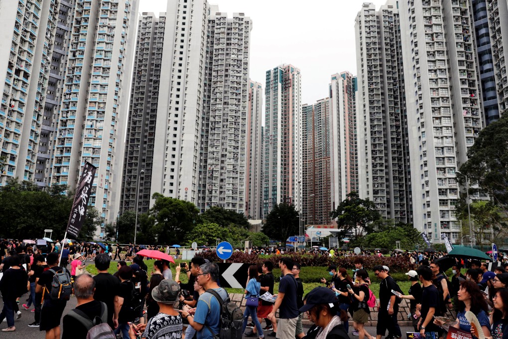 Protesters march in Tseung Kwan O, a residential district in Hong Kong, on August 4. Photo: Reuters