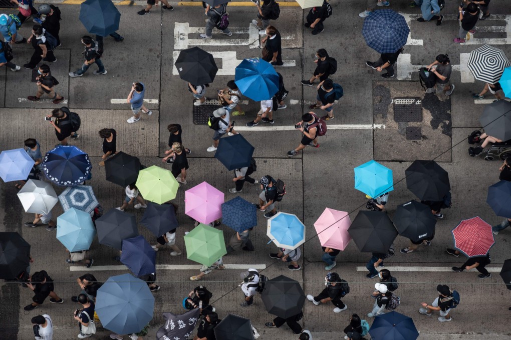 Hong Kong protesters march in Causeway Bay on Sunday. Photo: AFP