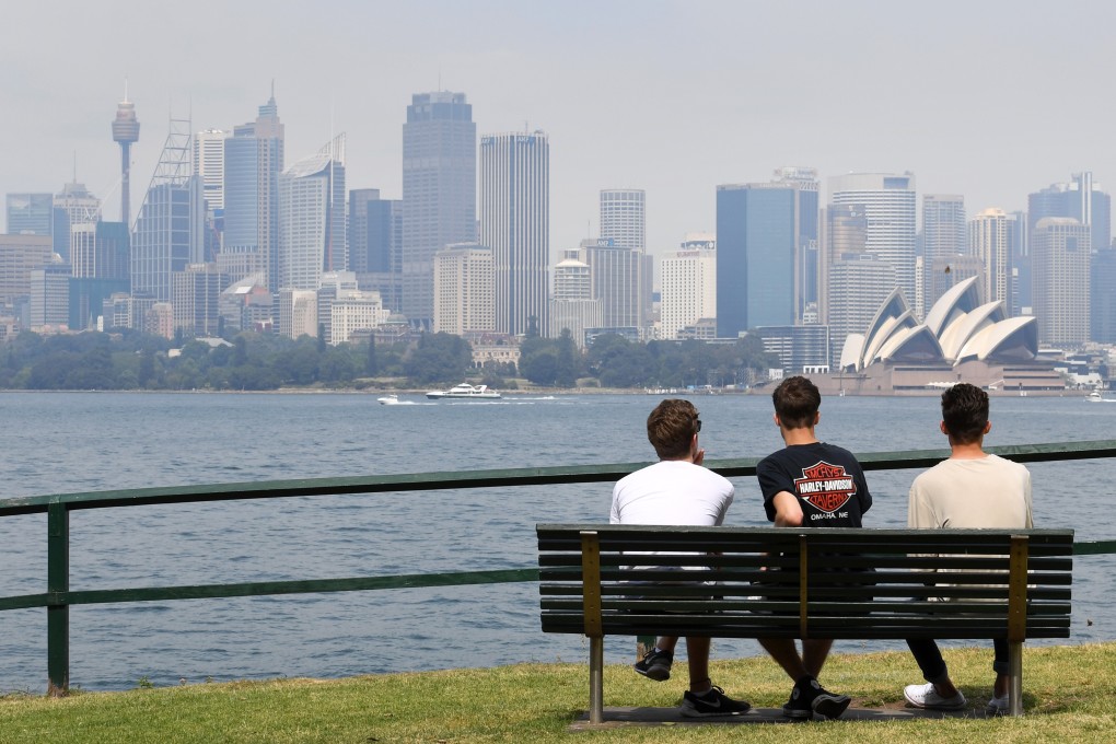 People look out over Sydney's skyline on a hazy day. Photo: AFP
