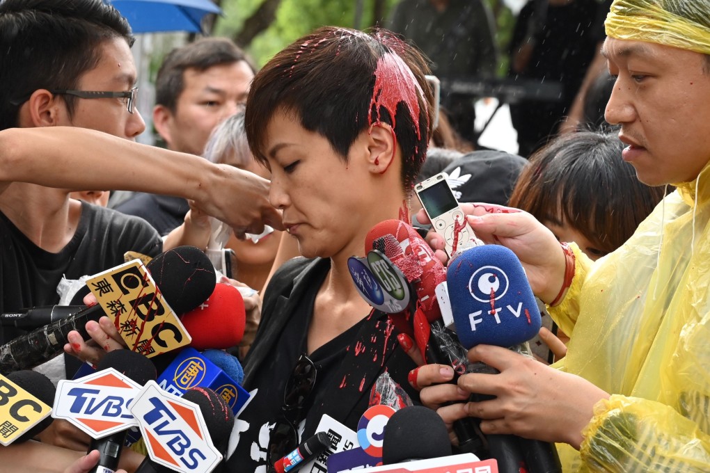 Hong Kong singer and activist Denise Ho was being interviewed on Sunday when she was showered in red paint. Photo: AFP