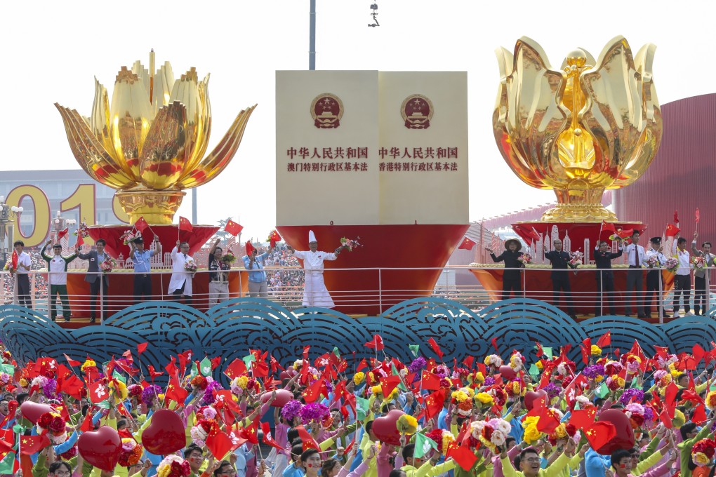 A float on the theme of the Hong Kong and Macau handovers passes through downtown Beijing as part of celebrations of the 70th anniversary of the People’s Republic. Photo: Simon Song