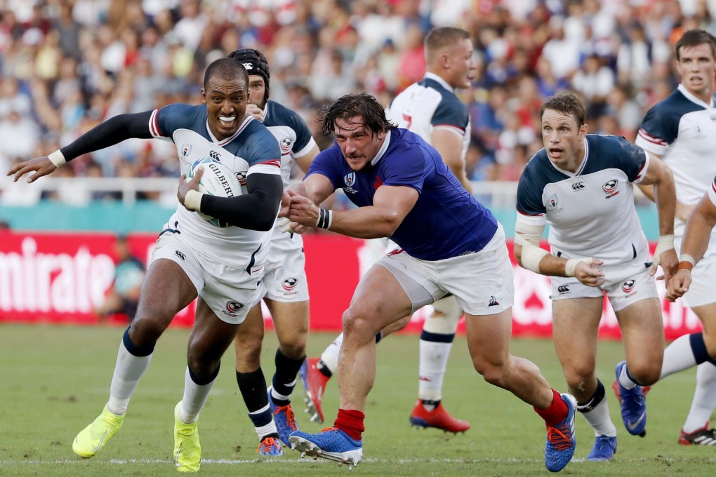 Marcel Brache, of the US, runs past France's defence during the Rugby World Cup Pool C game at Fukuoka Hakatanomori Stadium in Fukuoka. Photo: AP