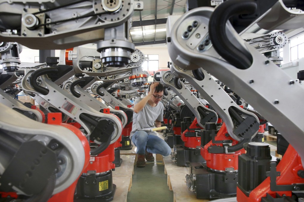 Checks are carried out on robotic arms at a factory producing industrial robots in Zhengyu town, in east China’s Jiangsu province. As China gets ready for a key Communist Party core committee meeting in October, policymakers are likely to increasingly prioritise manufacturing. Photo: AP
