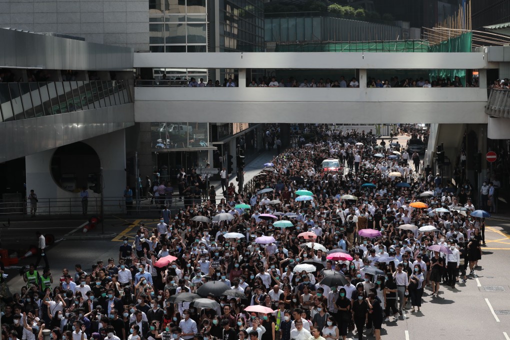 Hundreds of protesters march along one of Hong Kong’s busiest roads. Photo: Sam Tsang